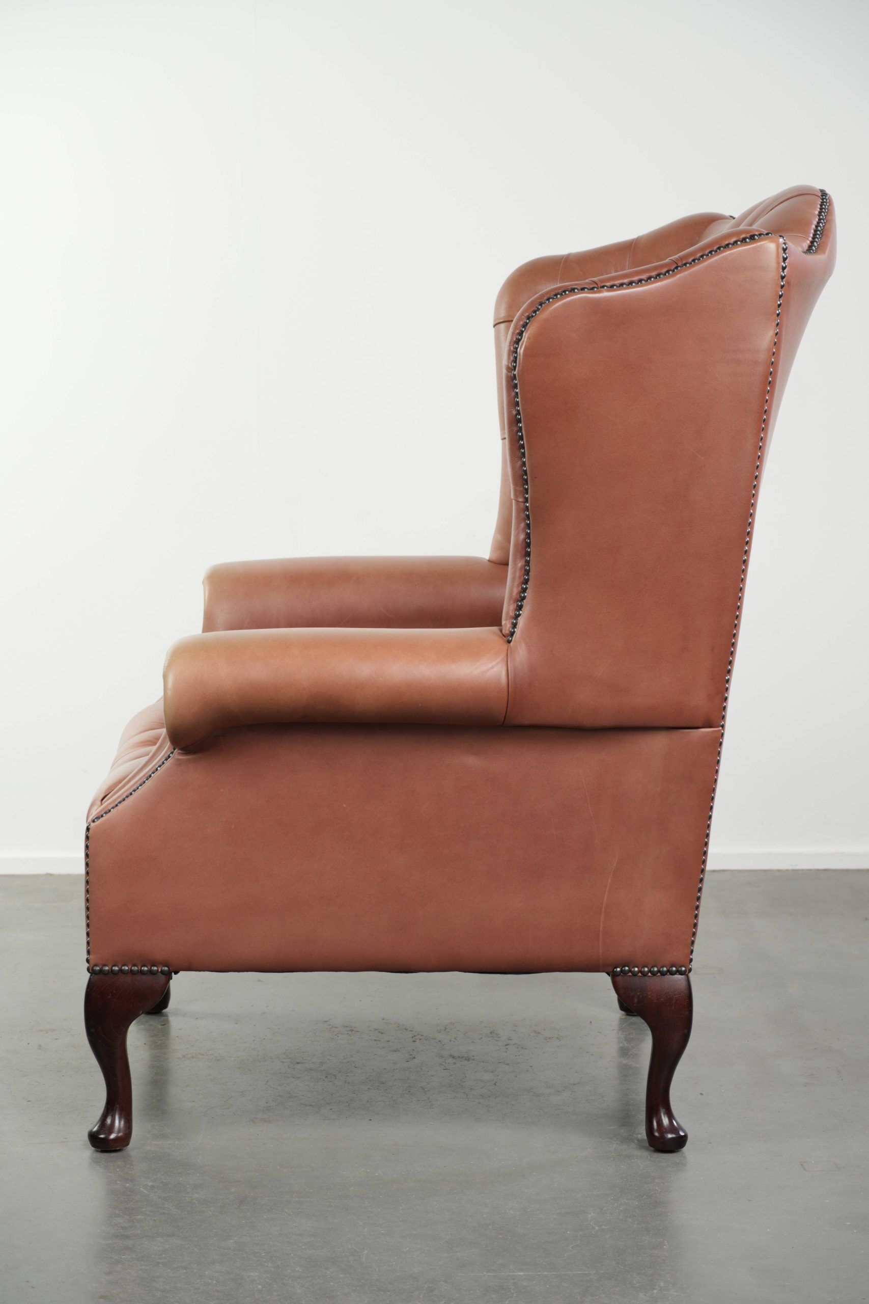 Classic English cowhide button seat chesterfield wingback armchair