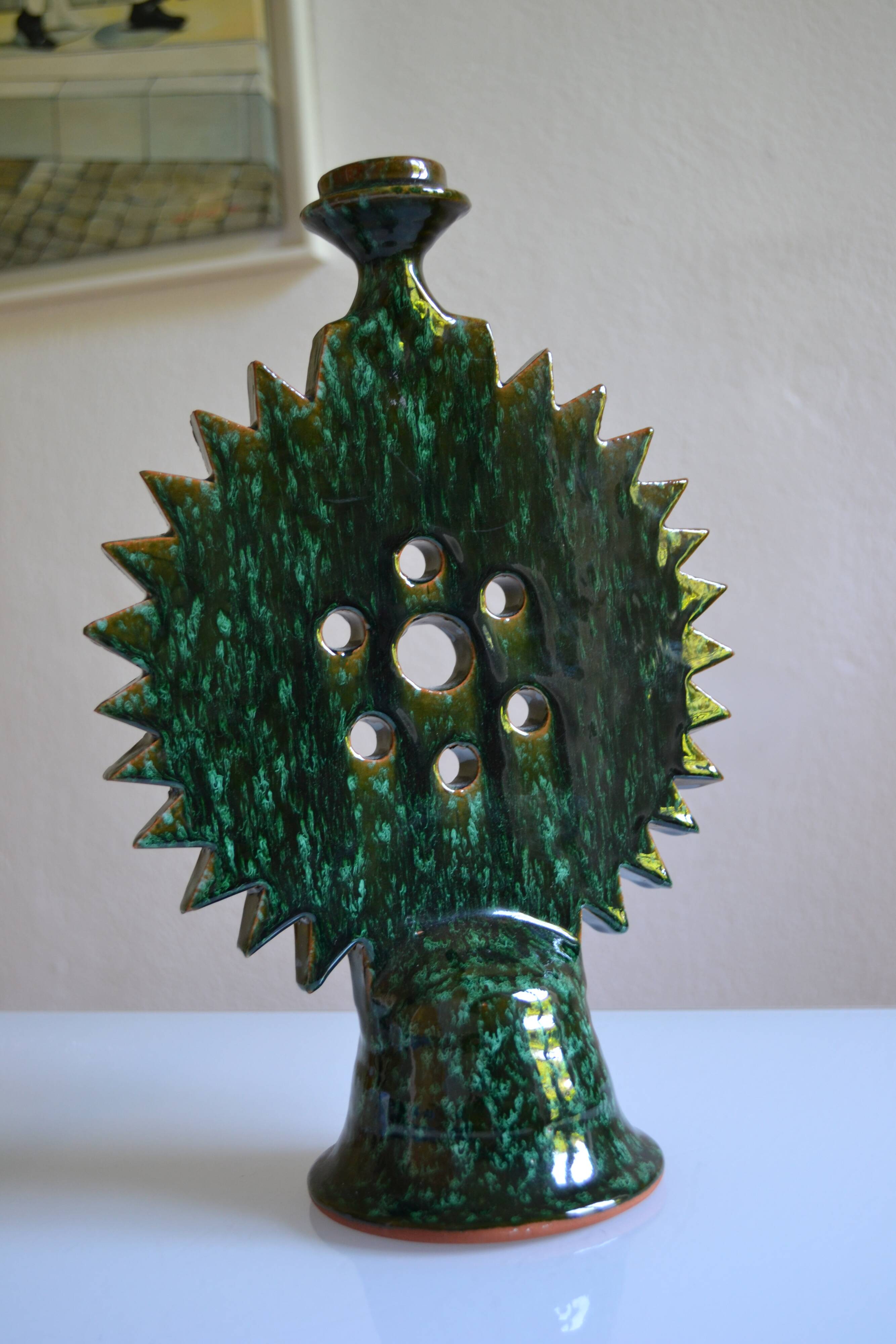 Green ceramic sun candlestick from Tamegroute, Morocco.