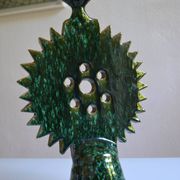 Green ceramic sun candlestick from Tamegroute, Morocco.