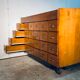 Double-sided wooden industrial filing cabinet with 48 vintage drawers