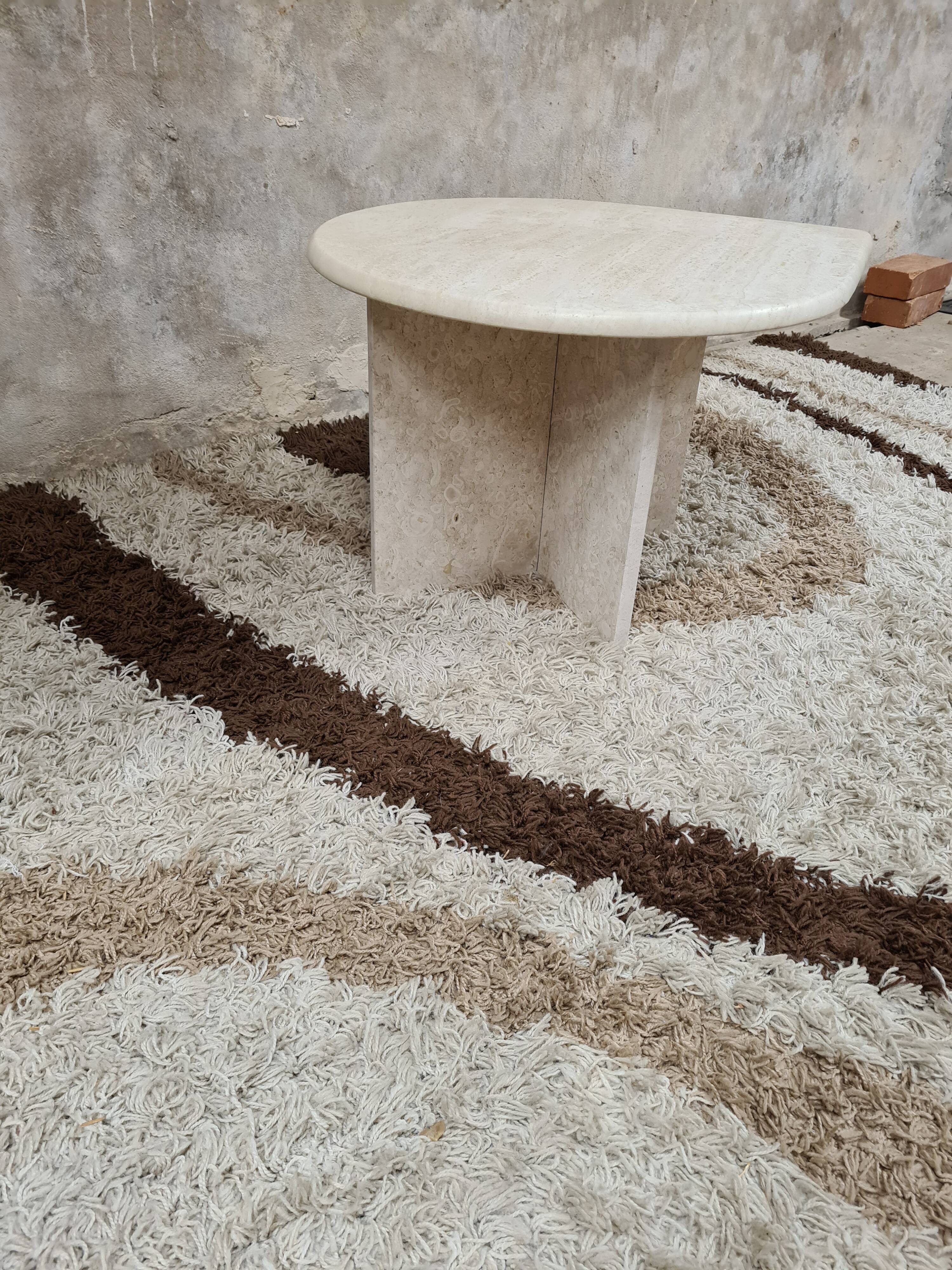 Travertine drop-shaped coffee table