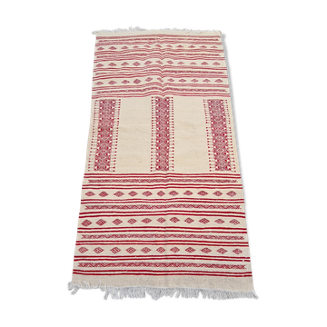 Traditional ethnic-patterned red and white carpet