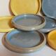 Seven vintage potter's sweet treat plates