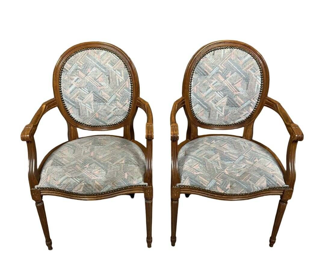 Paire de fauteuils louis XVI a dossiers médaillons