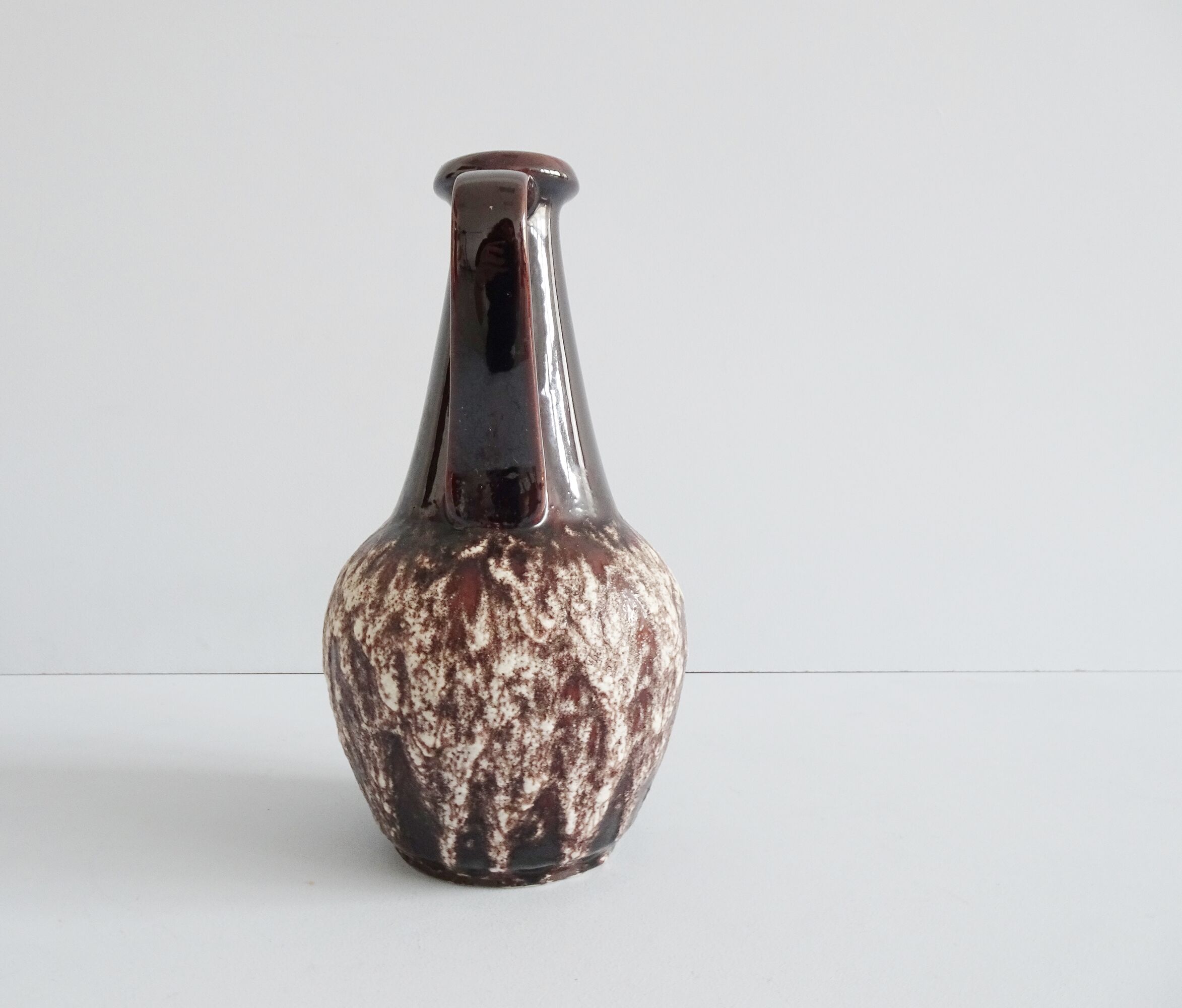 Bay ceramic pitcher with handle and fat lava glaze