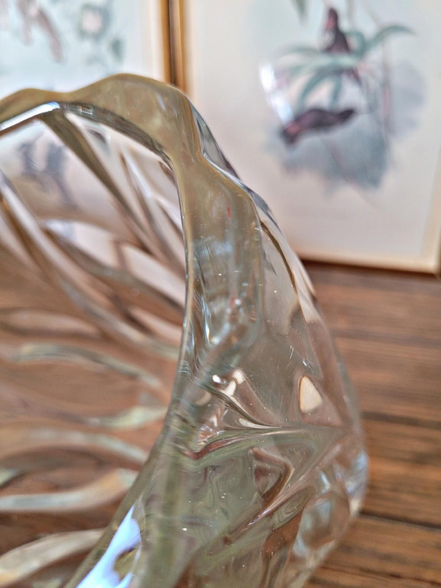 Vintage thick glass vase with twisted ribbed relief.