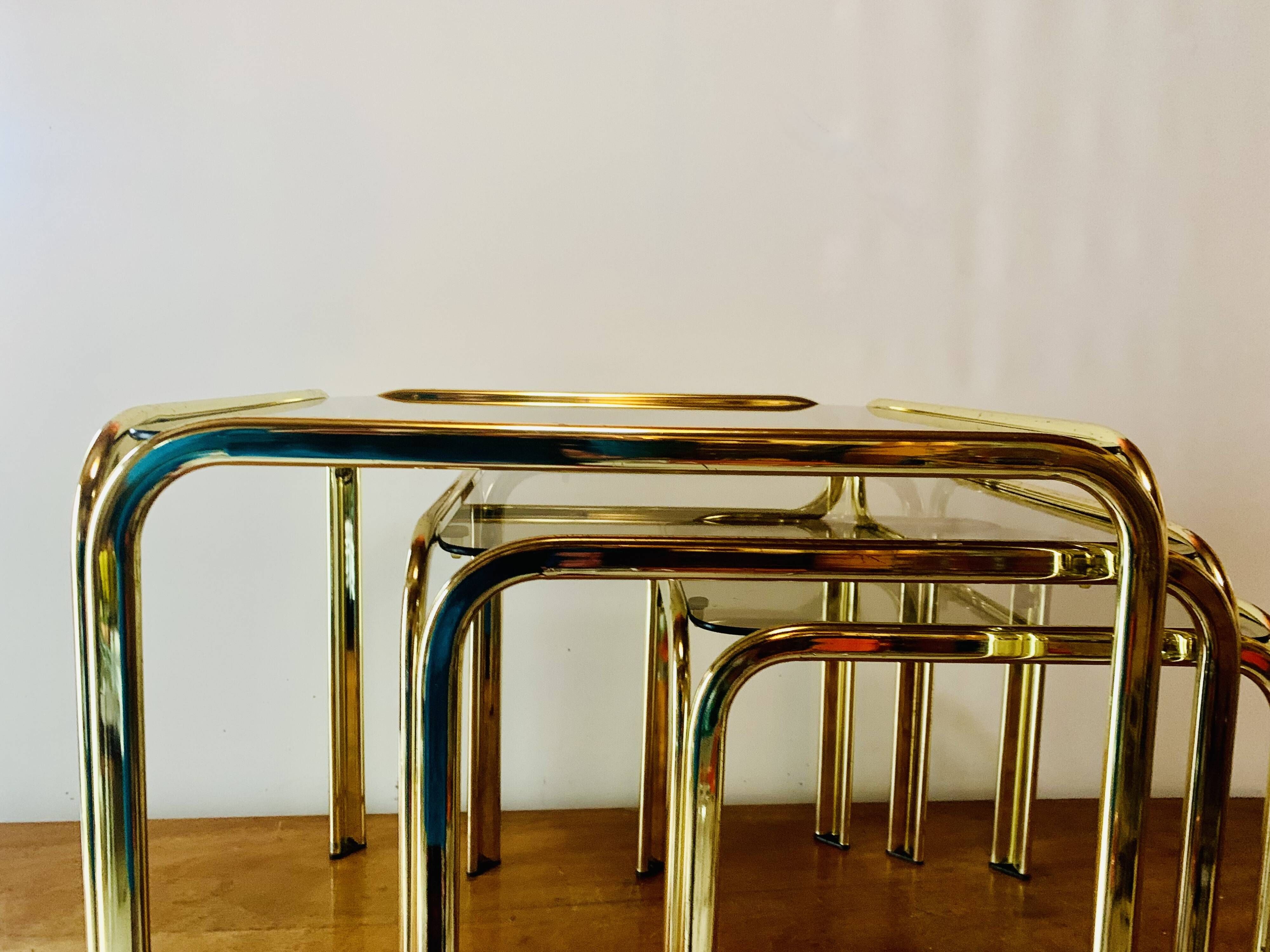 Vintage nesting tables in gold metal and smoked glass