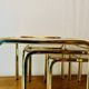Vintage nesting tables in gold metal and smoked glass