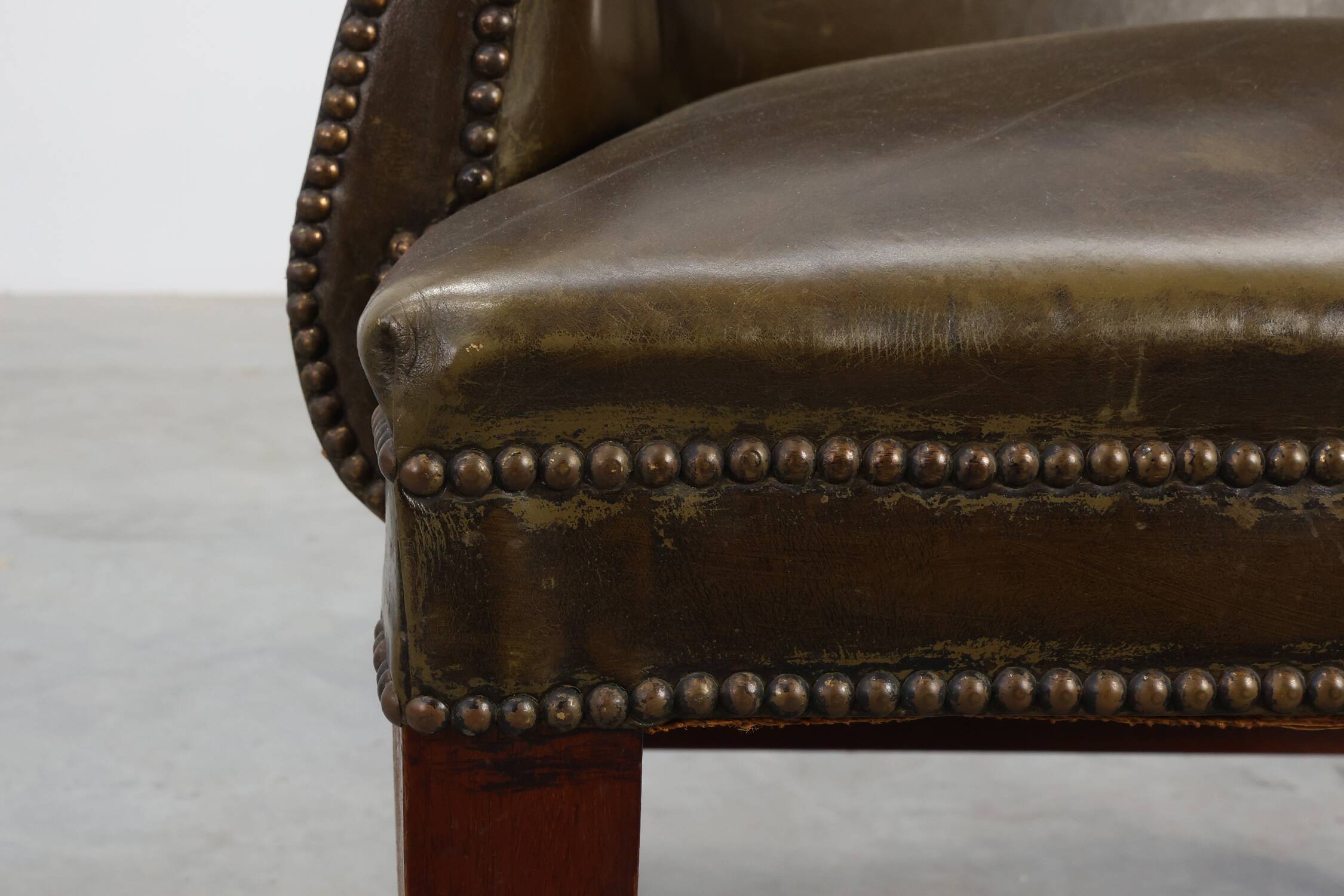 Mid-century Wing Back Armchair in green leather, UK