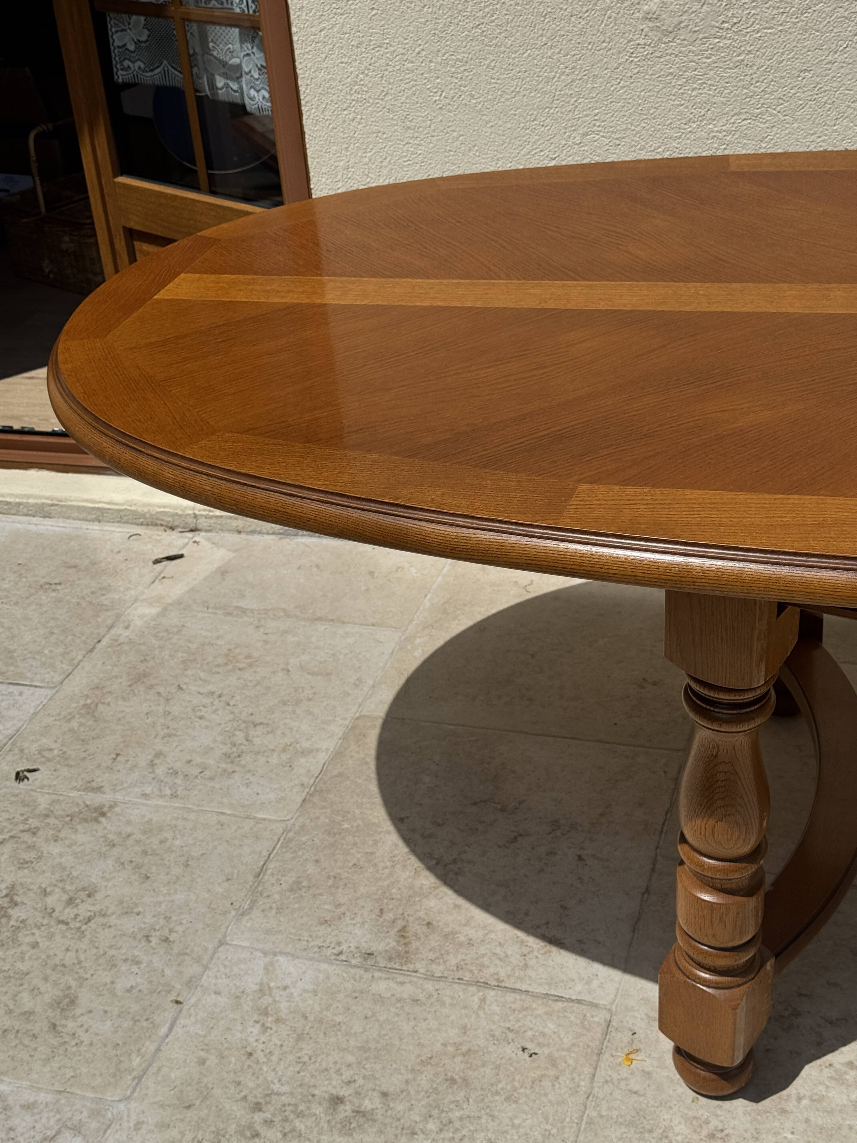 Oak dining table, oval living room table with two extensions.