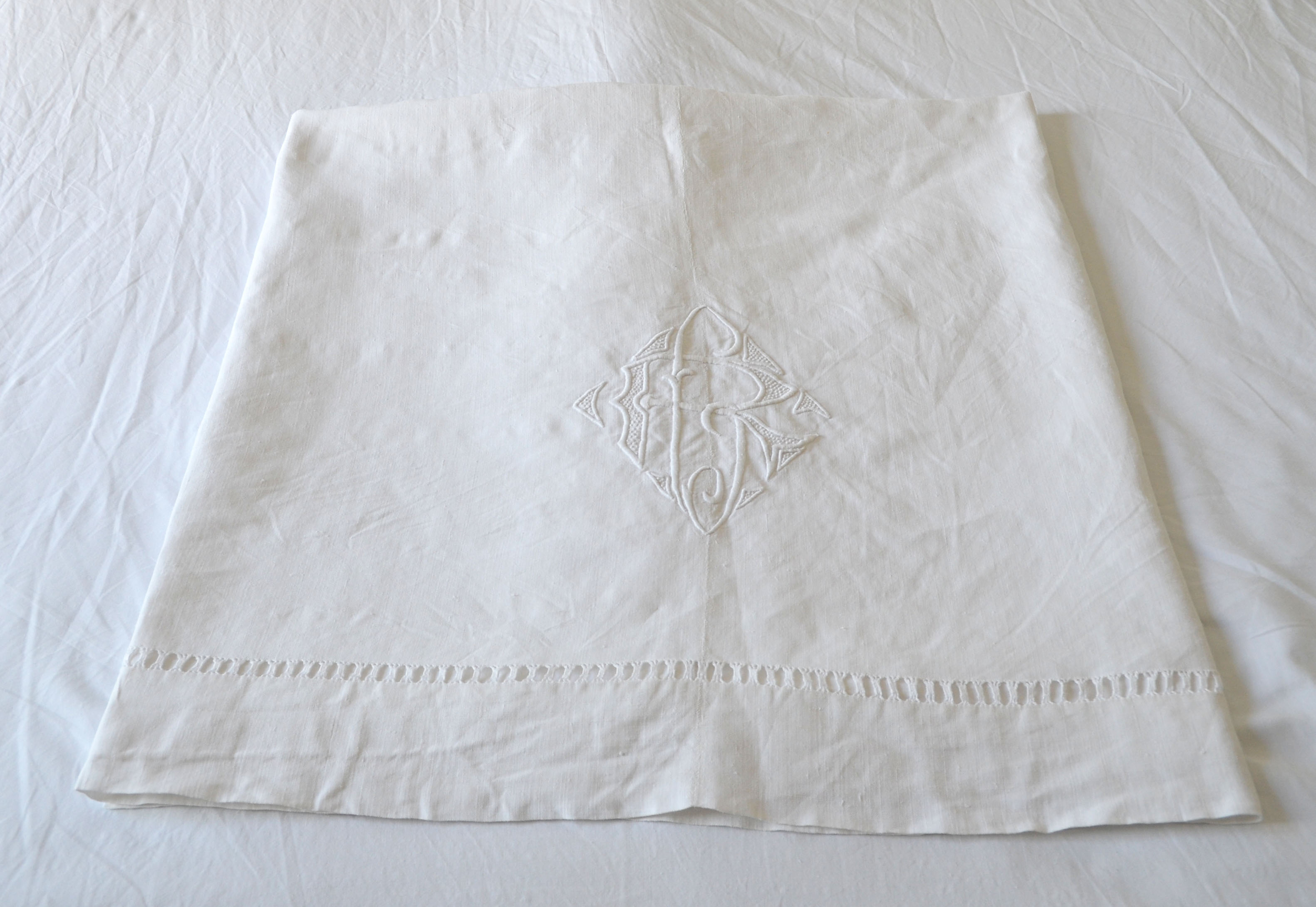 White sheet in monogrammed linen