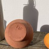 Gargoulette or old jug in yellow glazed terracotta