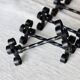 6 vintage black metal knife rests with scrollwork decoration