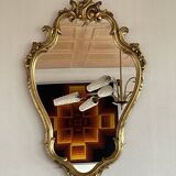 Old baroque style wall mirror with golden moldings