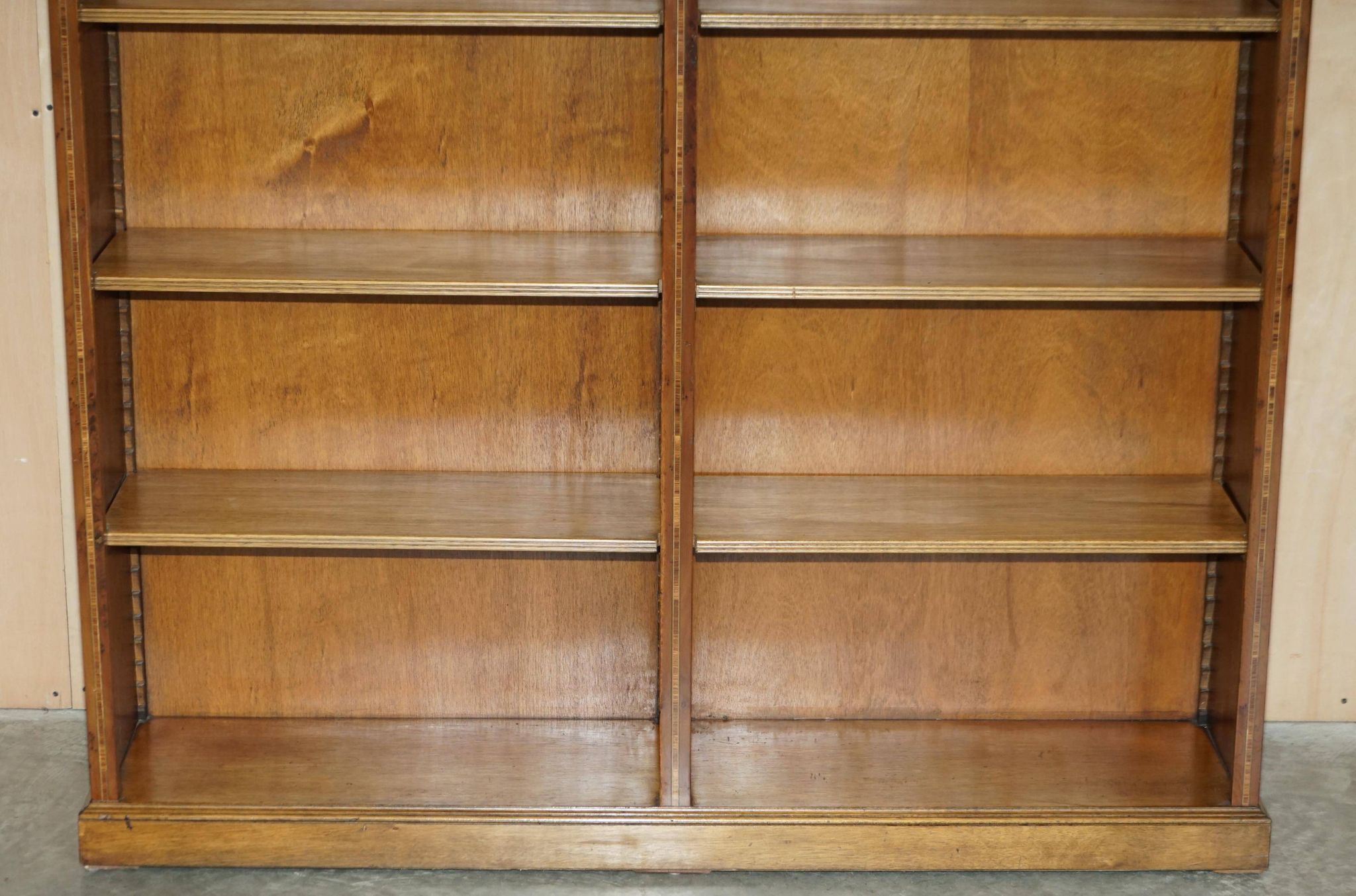 Pair of Sheraton Revival bookcases in satinwood, walnut, and yew.