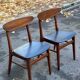 2 Scandinavian chairs in teak and black imitation leather, 1960s