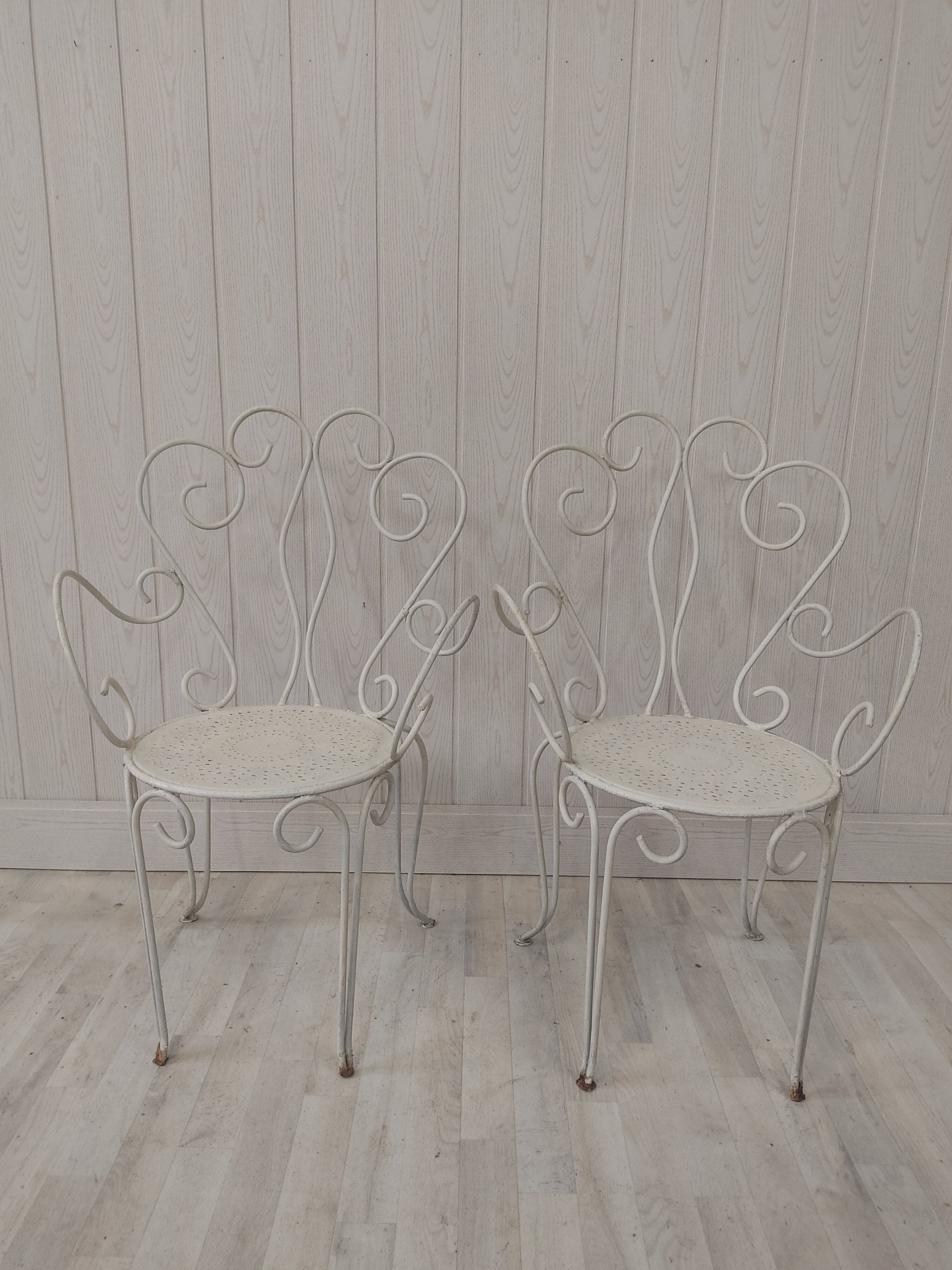 Pair of wrought iron garden chairs
