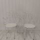 Pair of wrought iron garden chairs