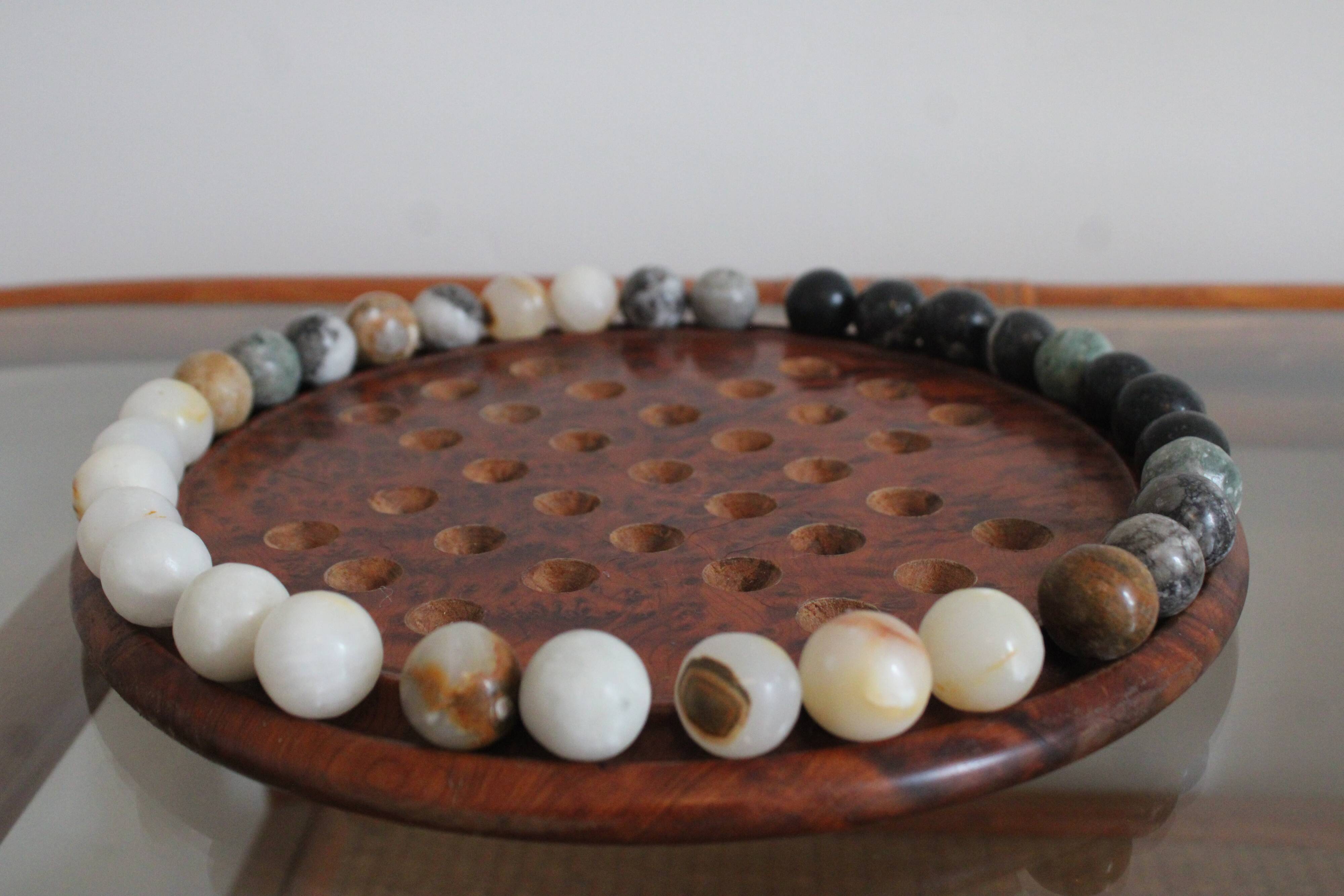 Solitaire game or mineral abacus