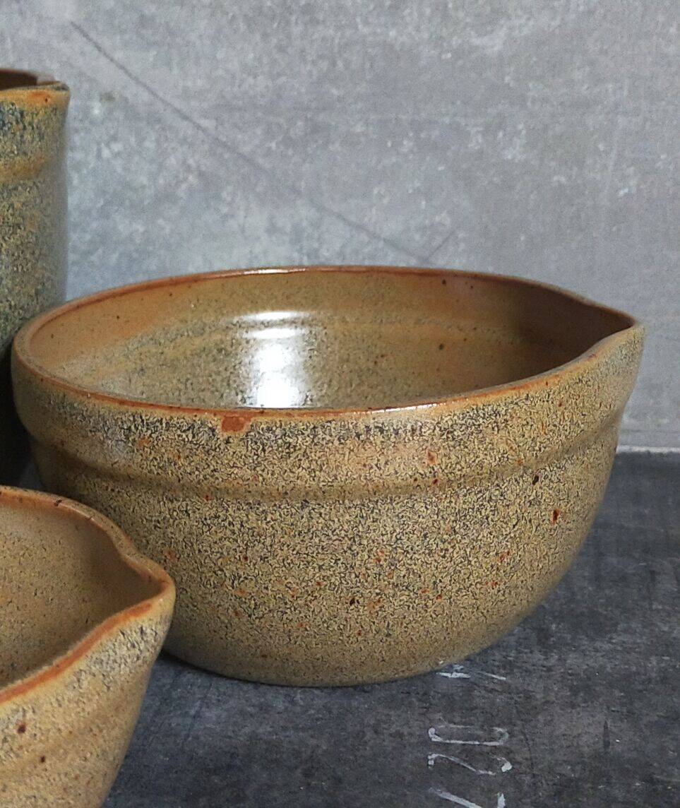 Three nesting pottery salad bowls in glazed stoneware