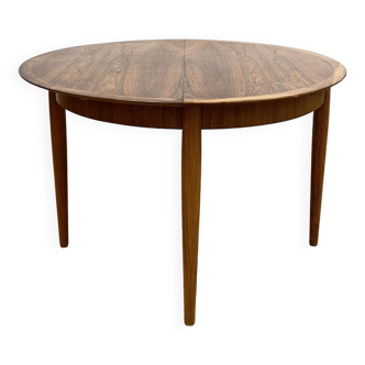 an extendable rosewood table by Lübke