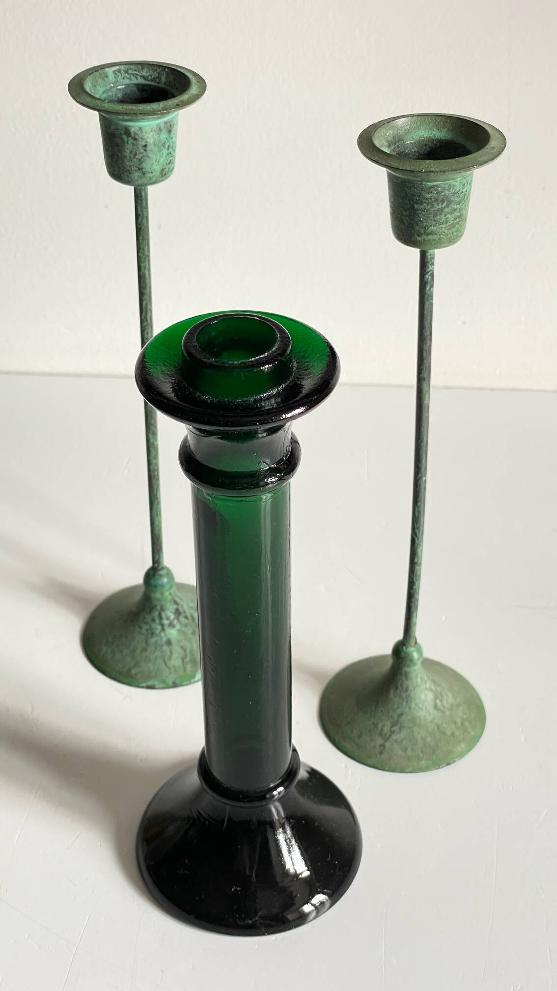 Green glass and metal candle holders