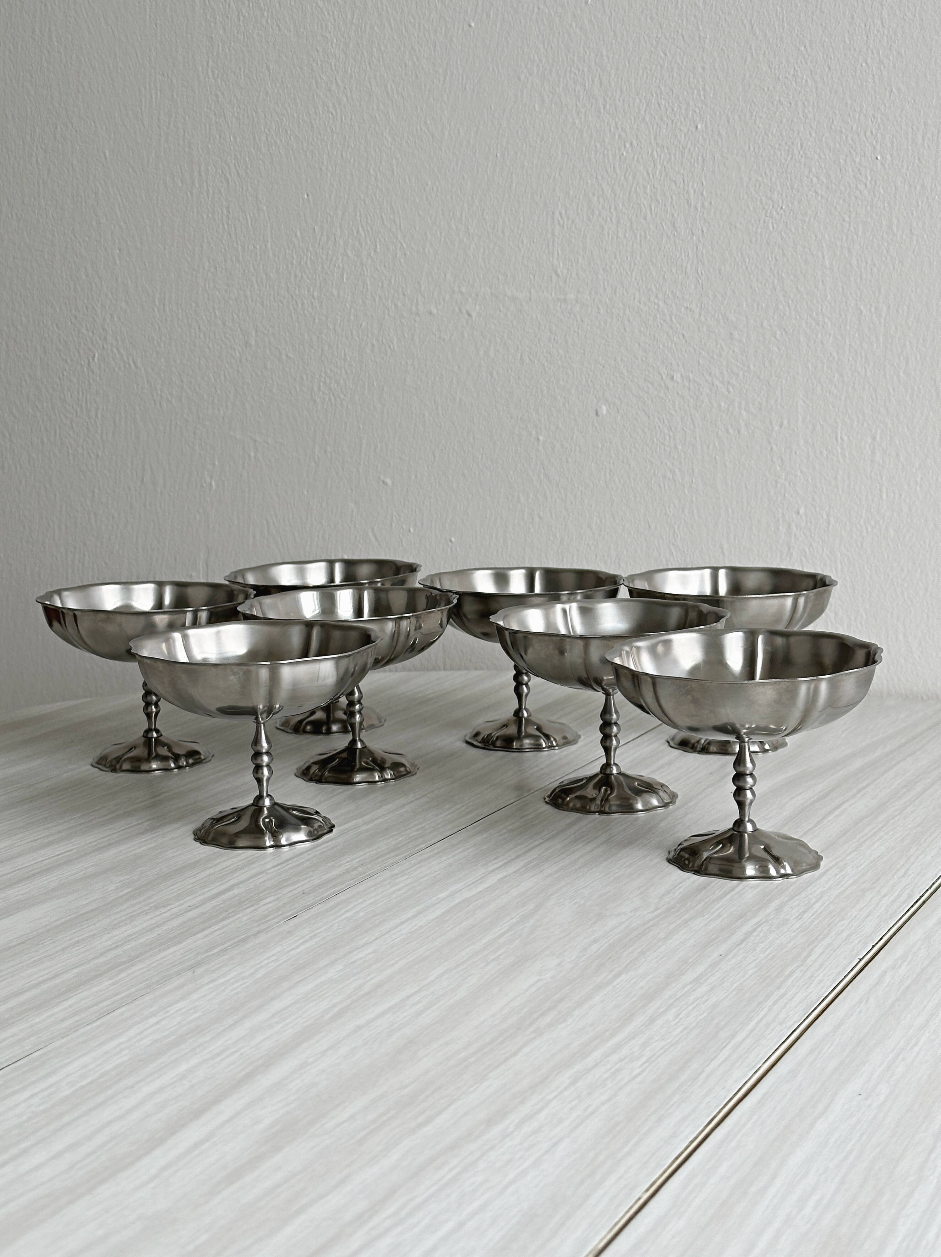 8 very large stainless steel footed bowls