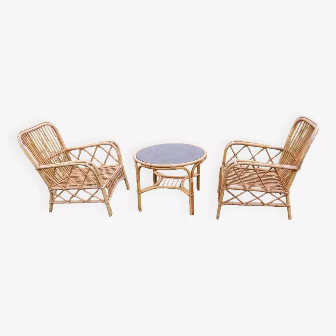 Vintage rattan garden furniture with cushions.