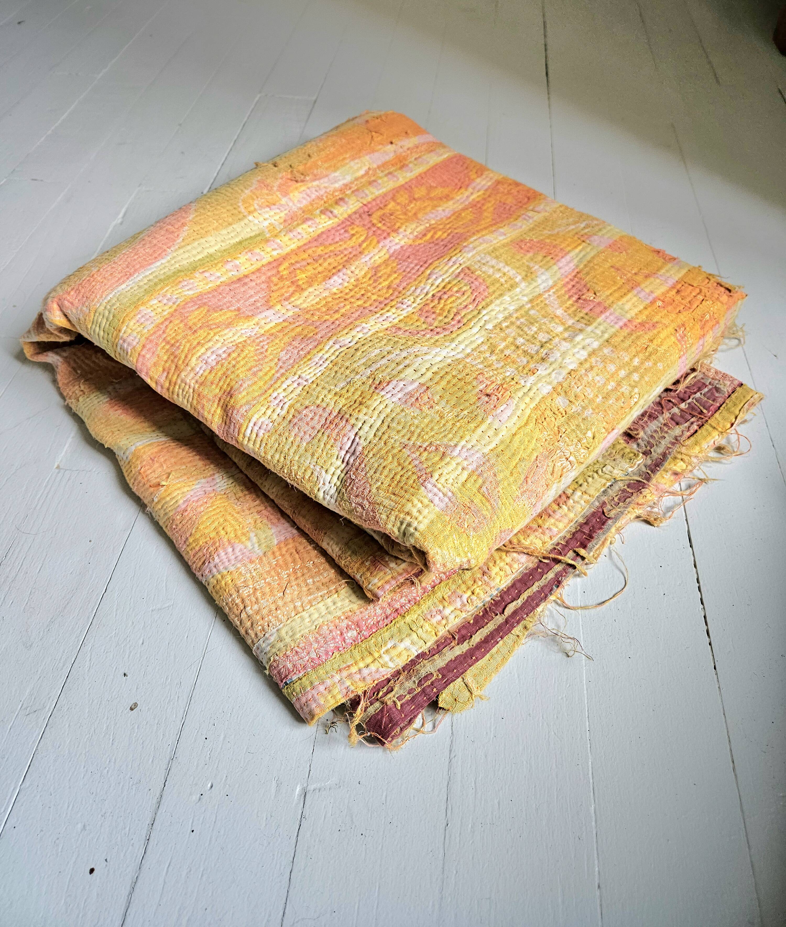 Fabric or plaid. old bed cover recycled and assembled worn deliberately