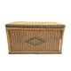 Large vintage wicker chest with green decoration.