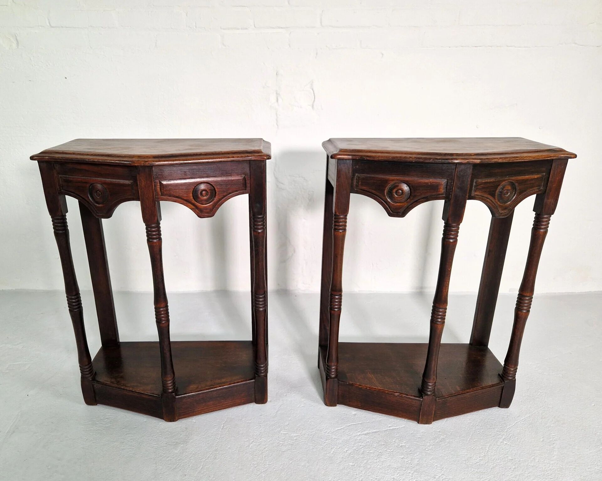 Pair of English 1920s carved oak sidetables