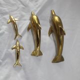 Family of dolphins in vintage brass