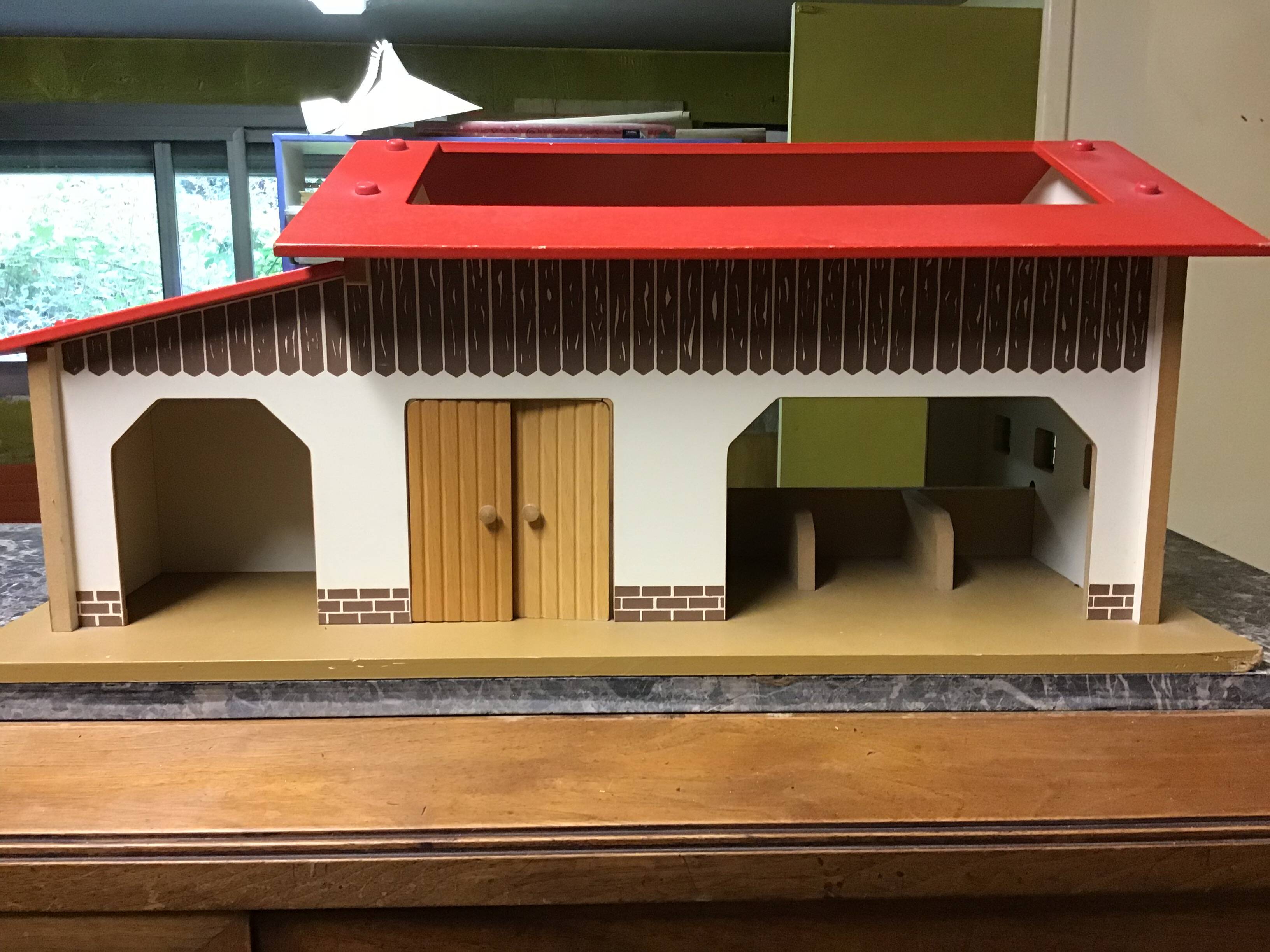 Wooden farm for children with animals.
