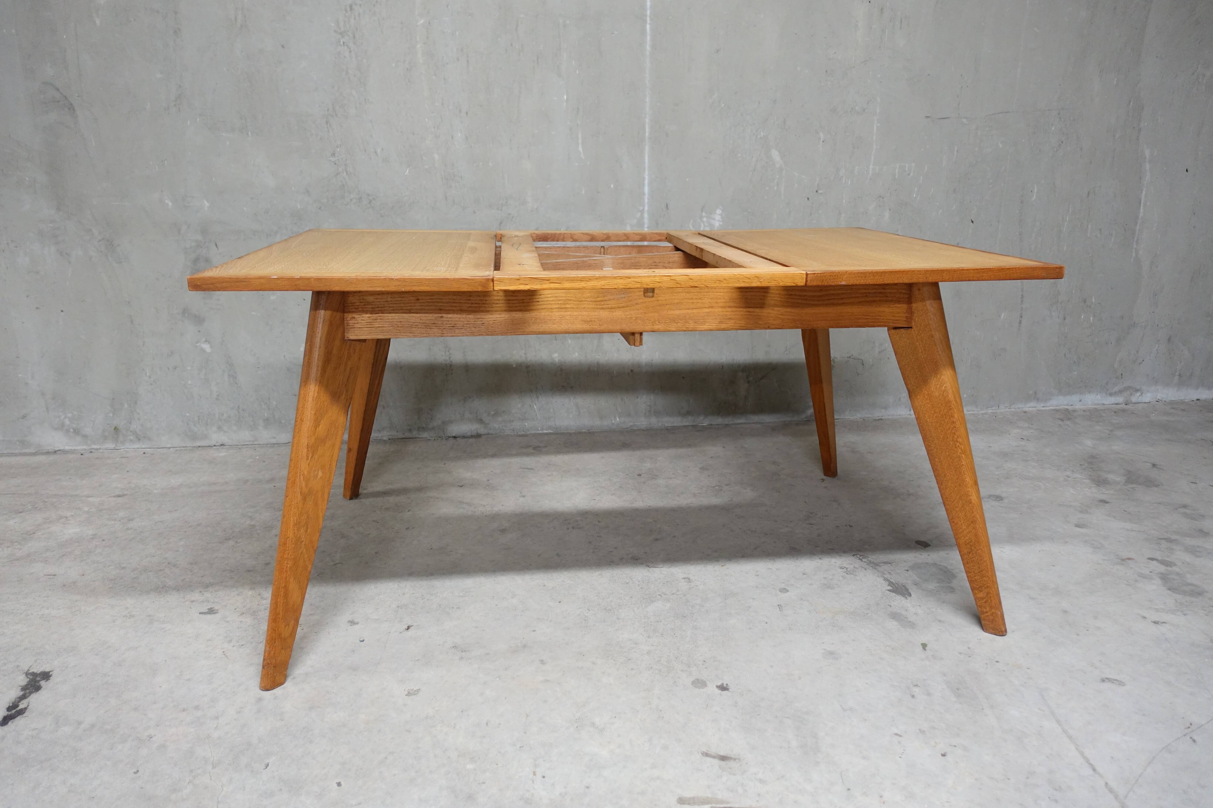 Dining table in blond oak compass feet 1950