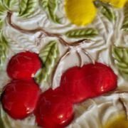Large vintage earthenware dish with a fruit pattern.