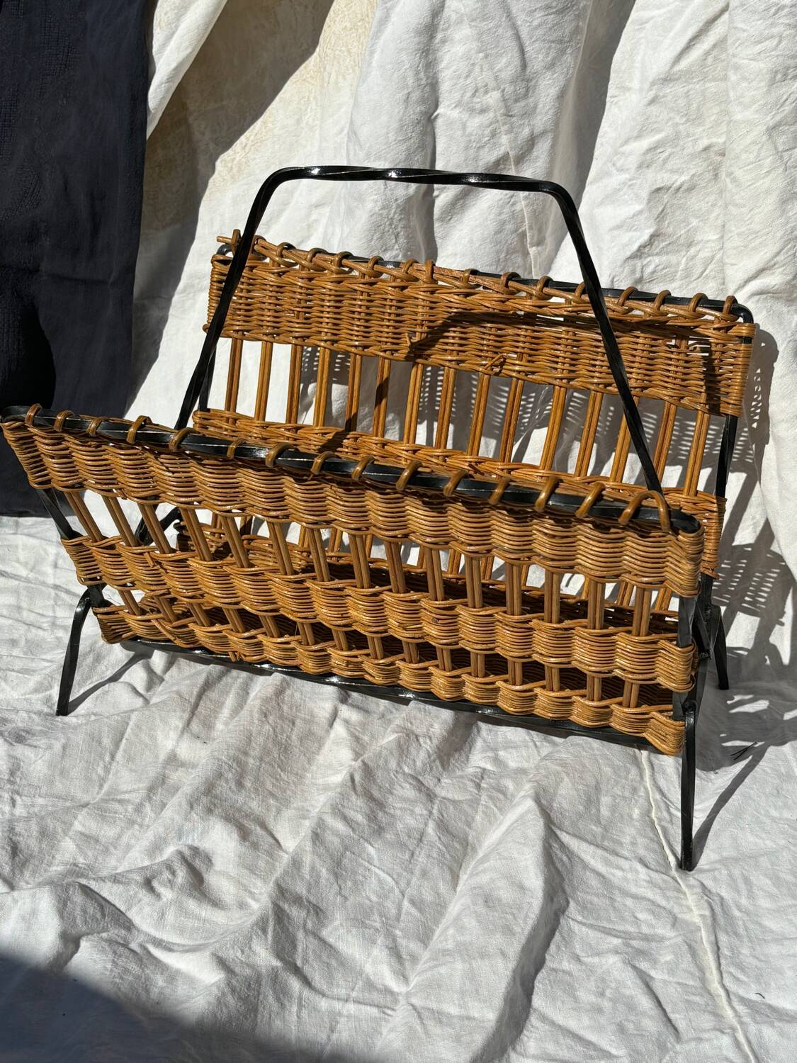 Vintage metal and wicker magazine rack