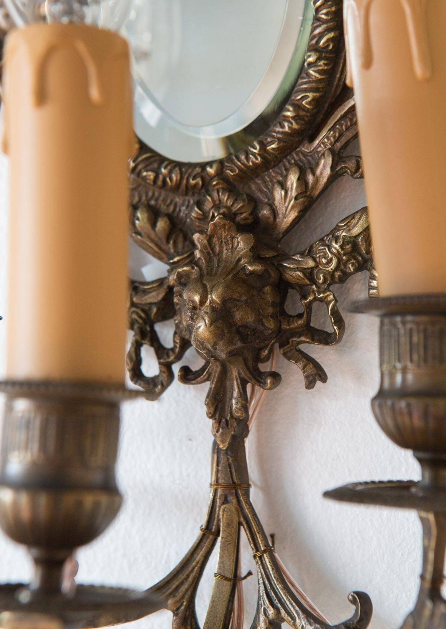 Pair of old French wall lights with beveled mirror and putti