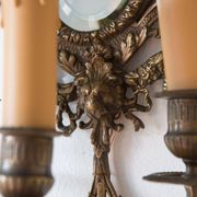 Pair of old French wall lights with beveled mirror and putti