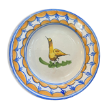 Earthenware plate representing a bird signed Lario