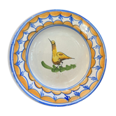 Assiette en faïence représentant un oiseau signée Lario