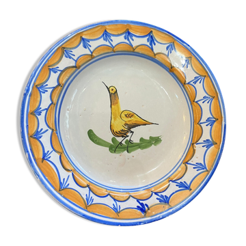 Earthenware plate representing a bird signed Lario