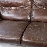 Two seater sofa upholstered with patinated brown leather and frame in metal, designed by Arne Norell