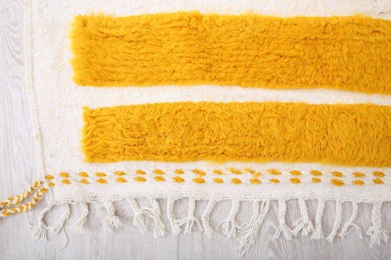 Handmade pure wool rug in traditional yellow, size 150 x 250 cm.