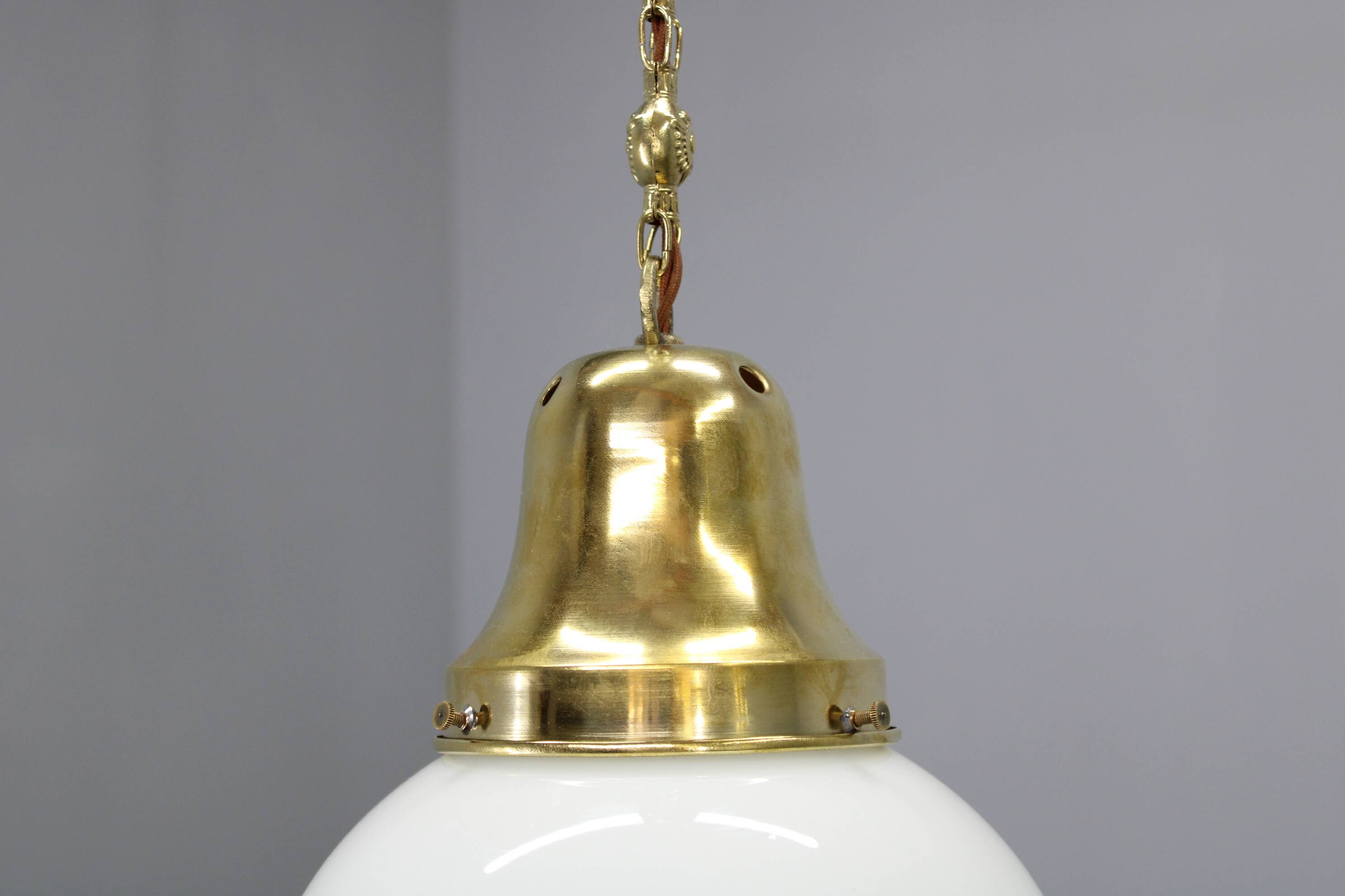 Pair of 1930s Peter Behrens Luzette pendants in opaline glass and brass