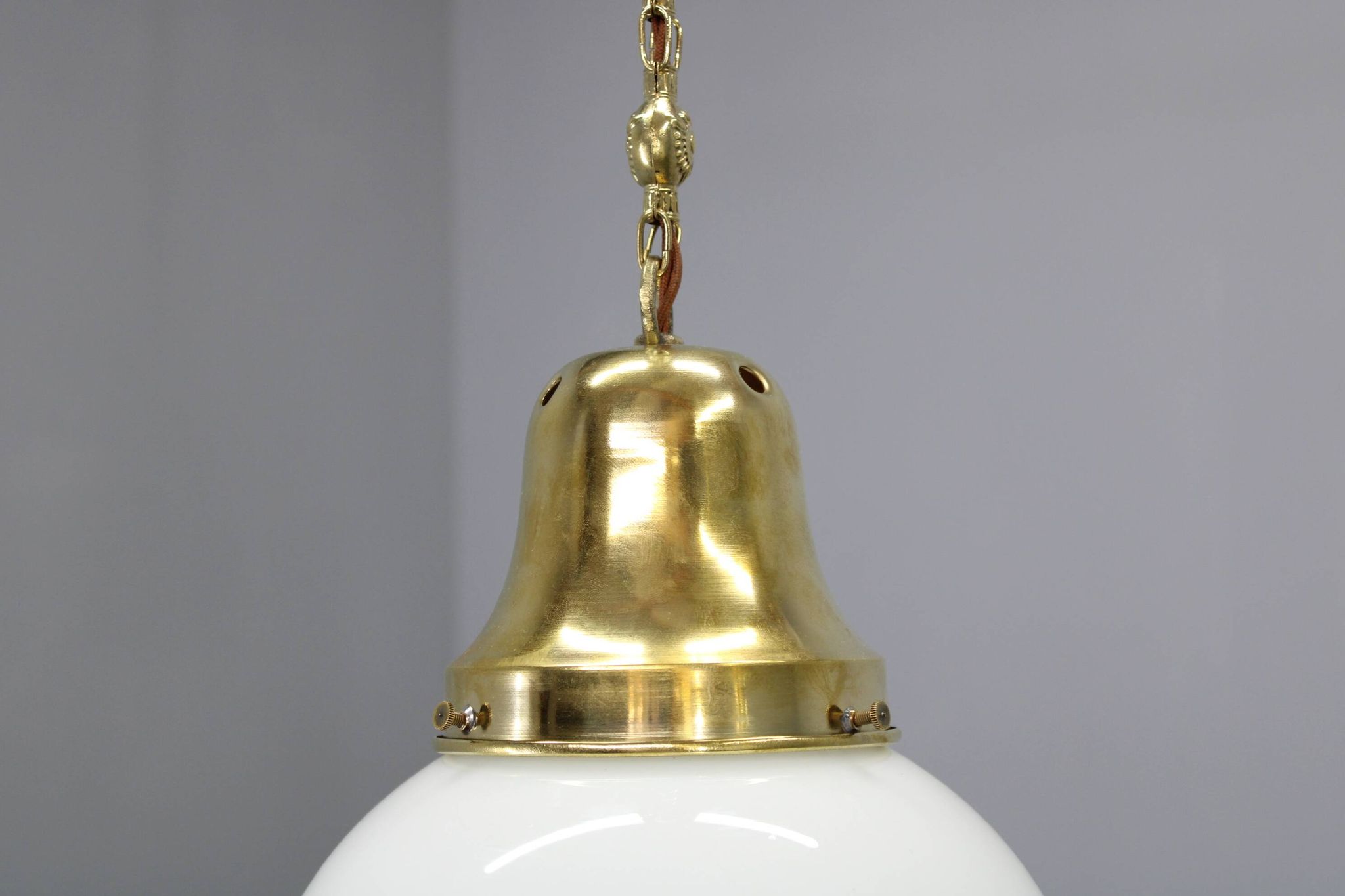 Pair of 1930s Peter Behrens Luzette pendants in opaline glass and brass