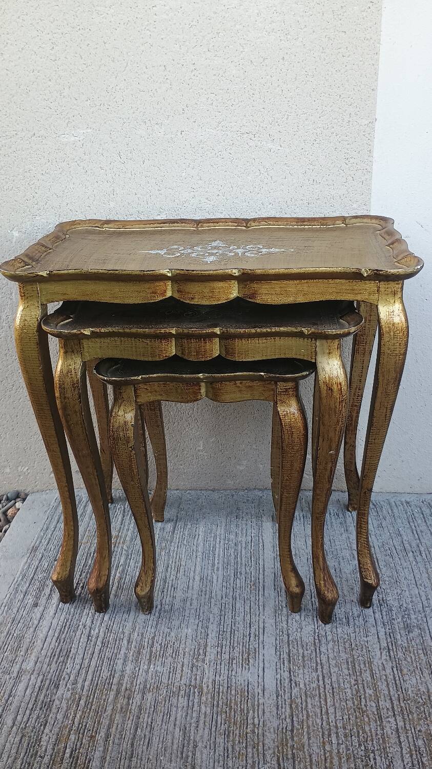 Set of three nesting tables in gilded wood in Florentine style Hollywo.