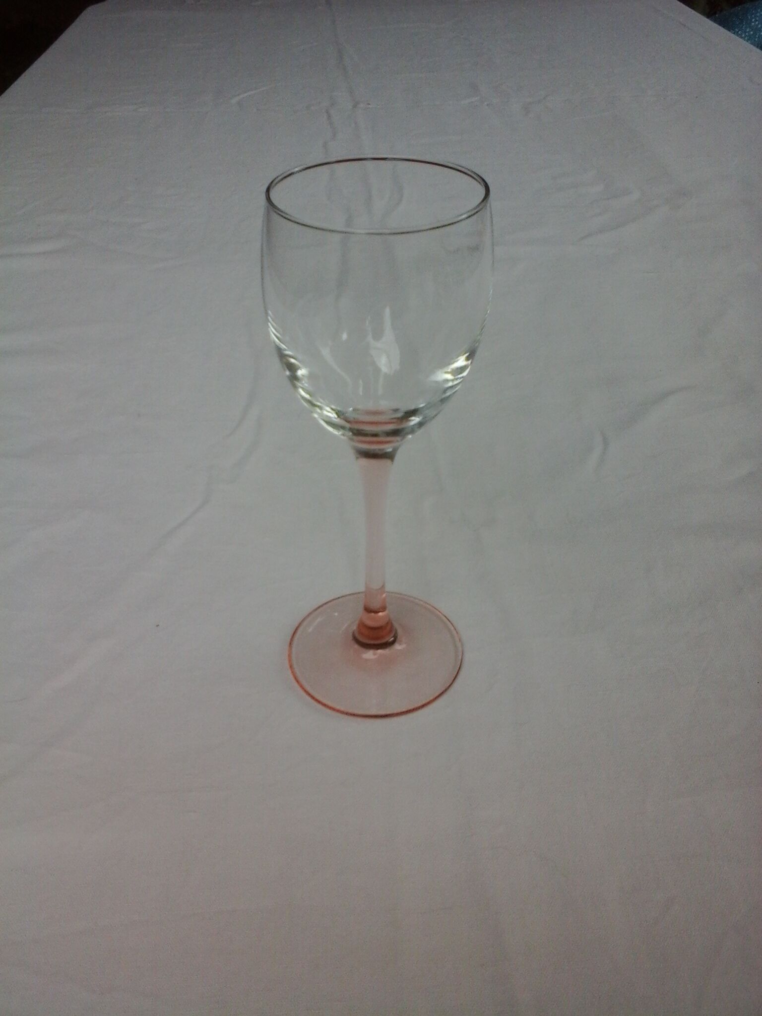 6 glasss of wine on pink foot