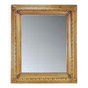 Large gilded wood and stucco mirror with foliage