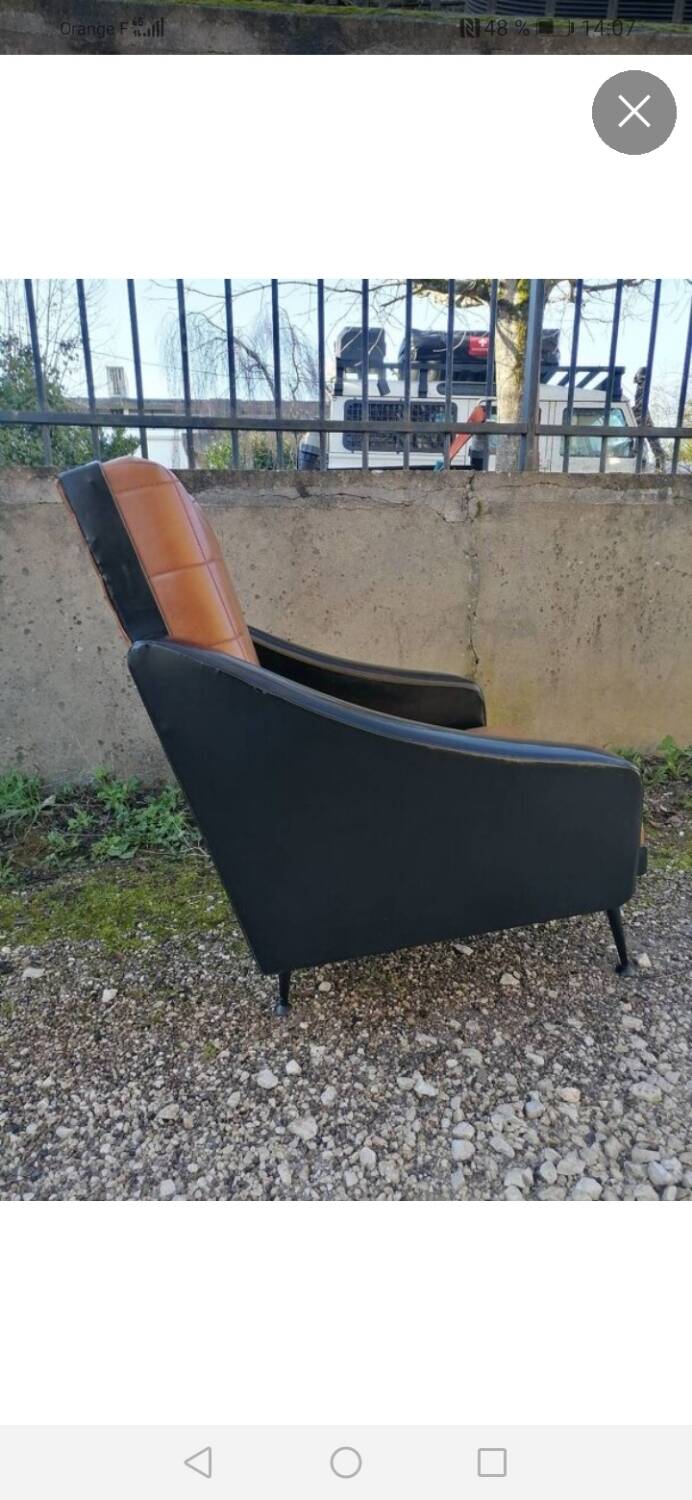 Pair of faux leather armchairs