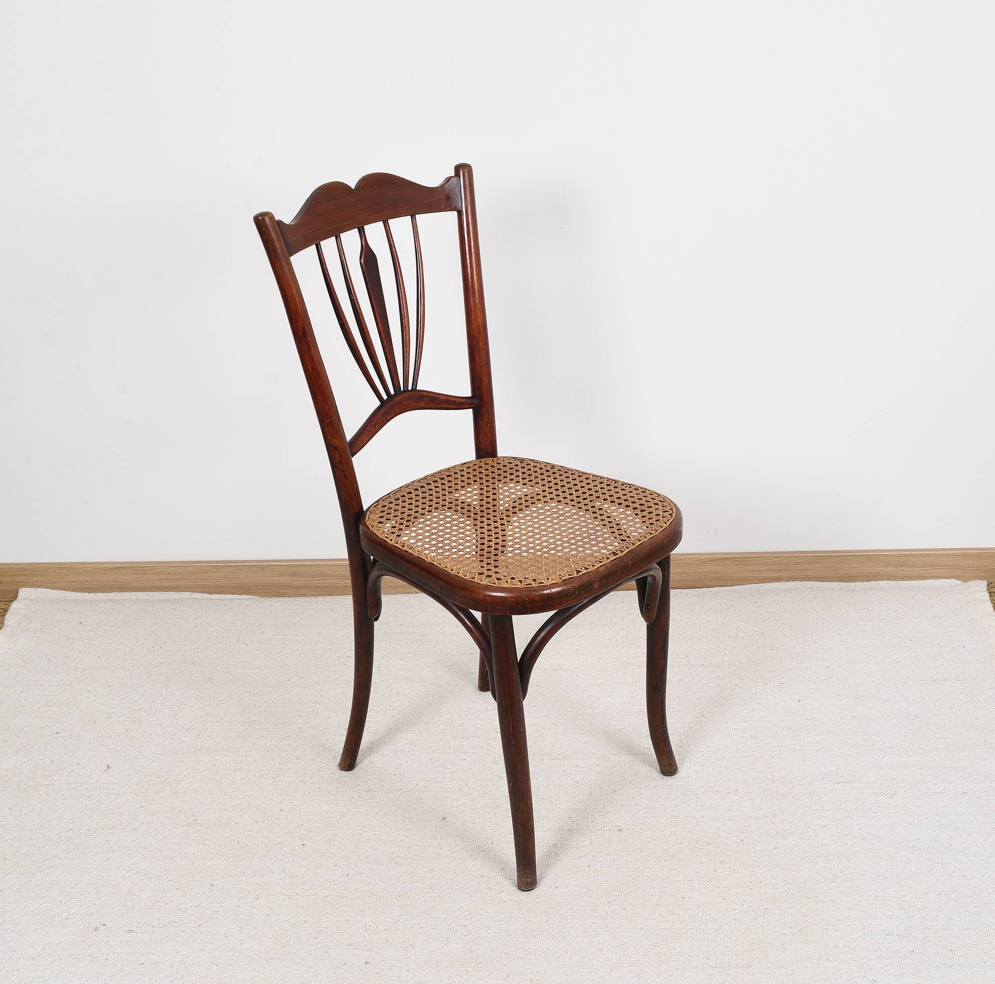 Old cane bistro chair, stamped fischel
